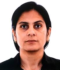 Dr. Simmi Kumari, Consultant Psychiatrist, smiling in a professional setting.